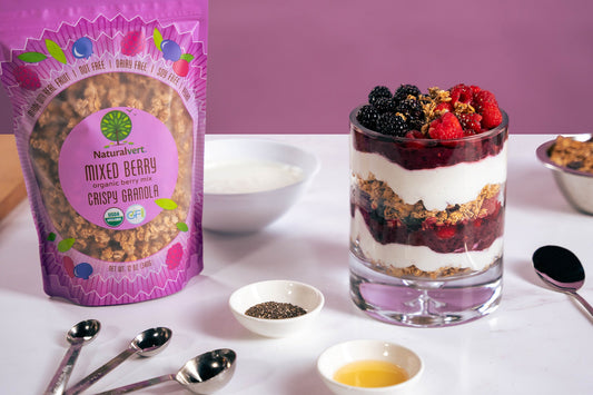 Yogurt parfait layered with Naturalvert mixed berry granola and fresh fruit — a sesame-free breakfast